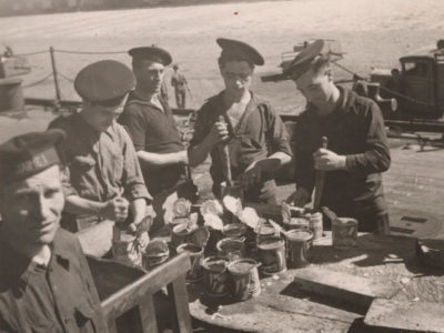 Sailors-opening-tins-with-knives,-Battleship-Jaime-I,-Almería,-Spain,-Gerda-Taro,-1937